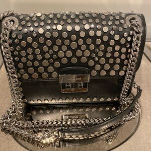 Michael Kors studied cross body